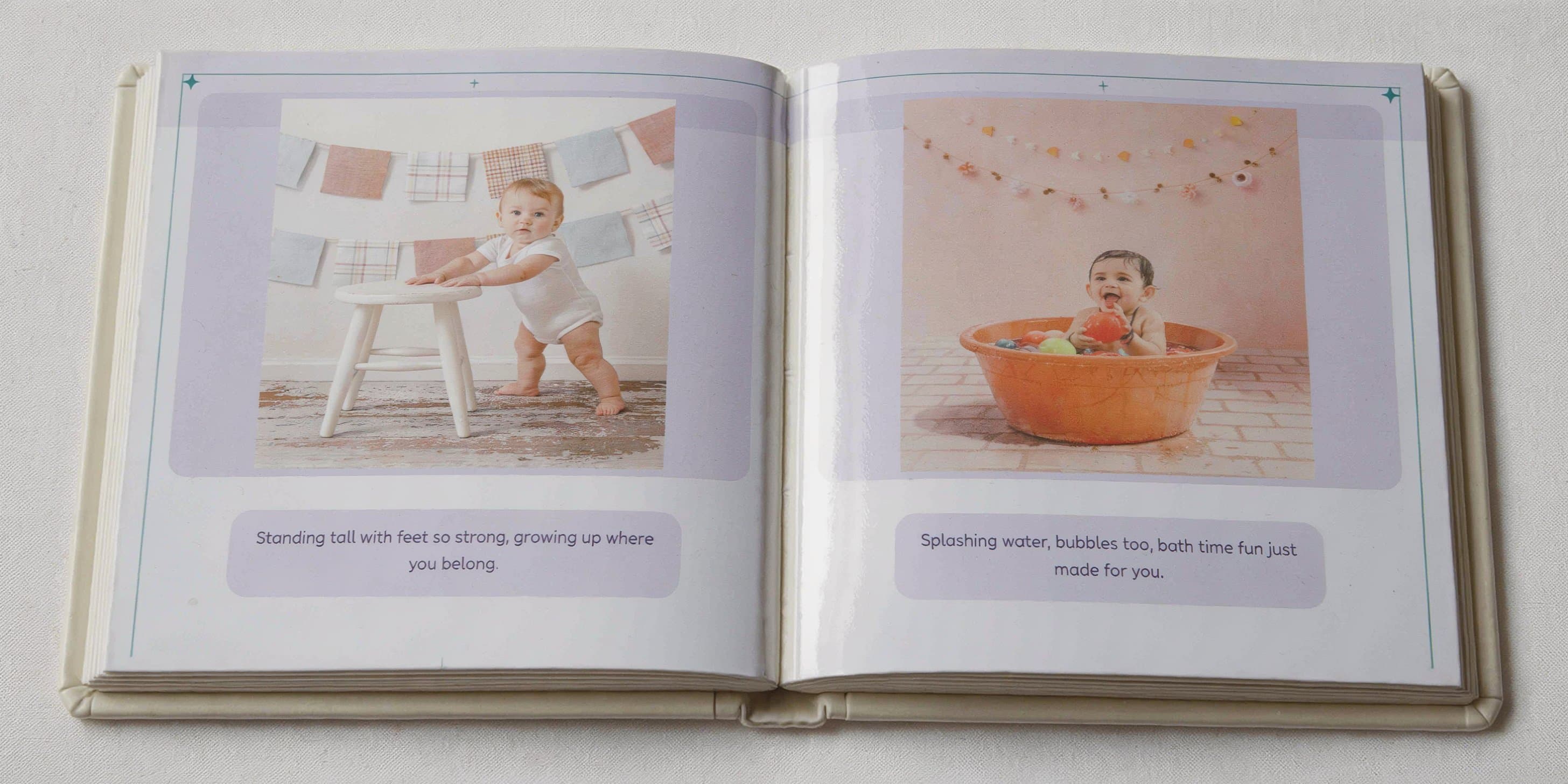 Storybook Firsts board book open to an interior spread showing watercolor illustrations with personalized rhyming story